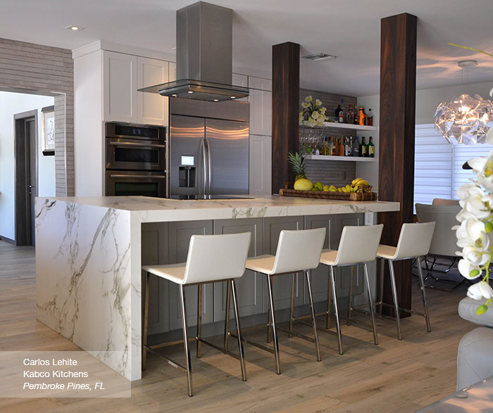 white cabinets in the dover door style with a gray kitchen island