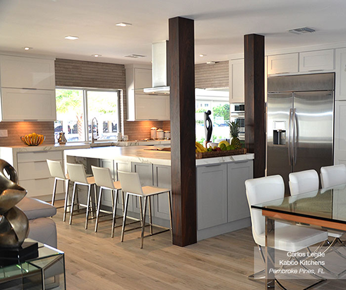 white cabinets in the dover door style with a gray kitchen island